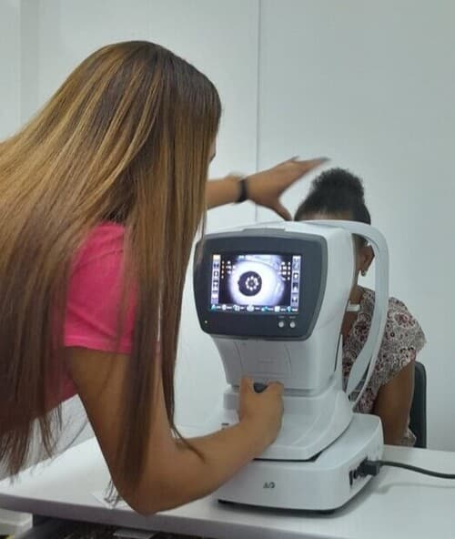 Eye care professional conducting an examination